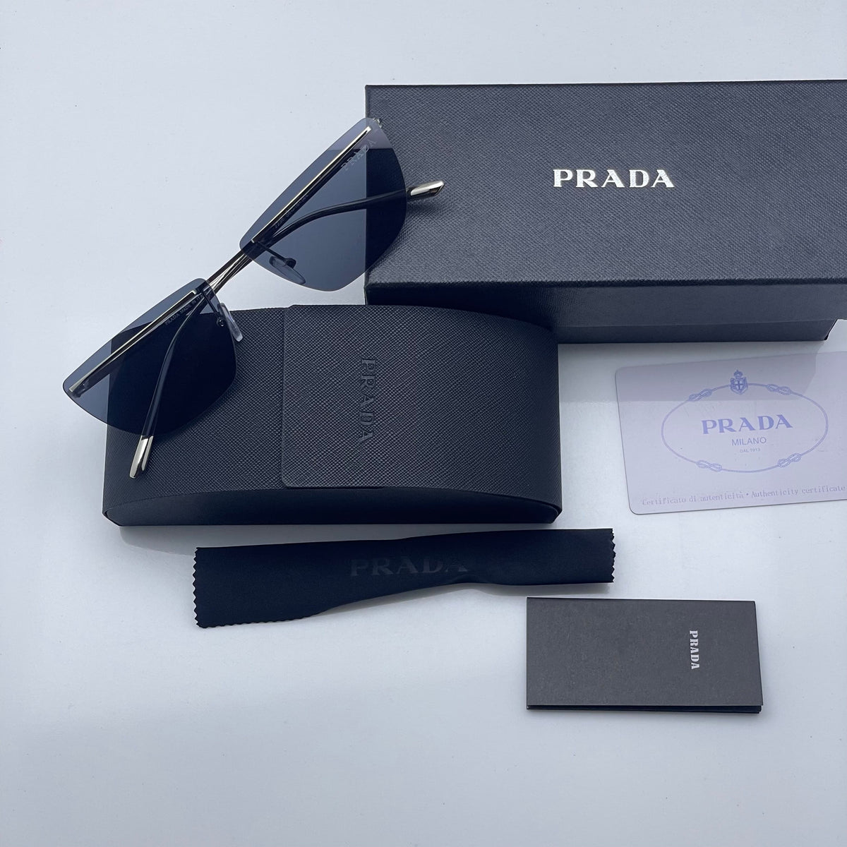 Pra_da black shaded golden sunglasses with original box kit